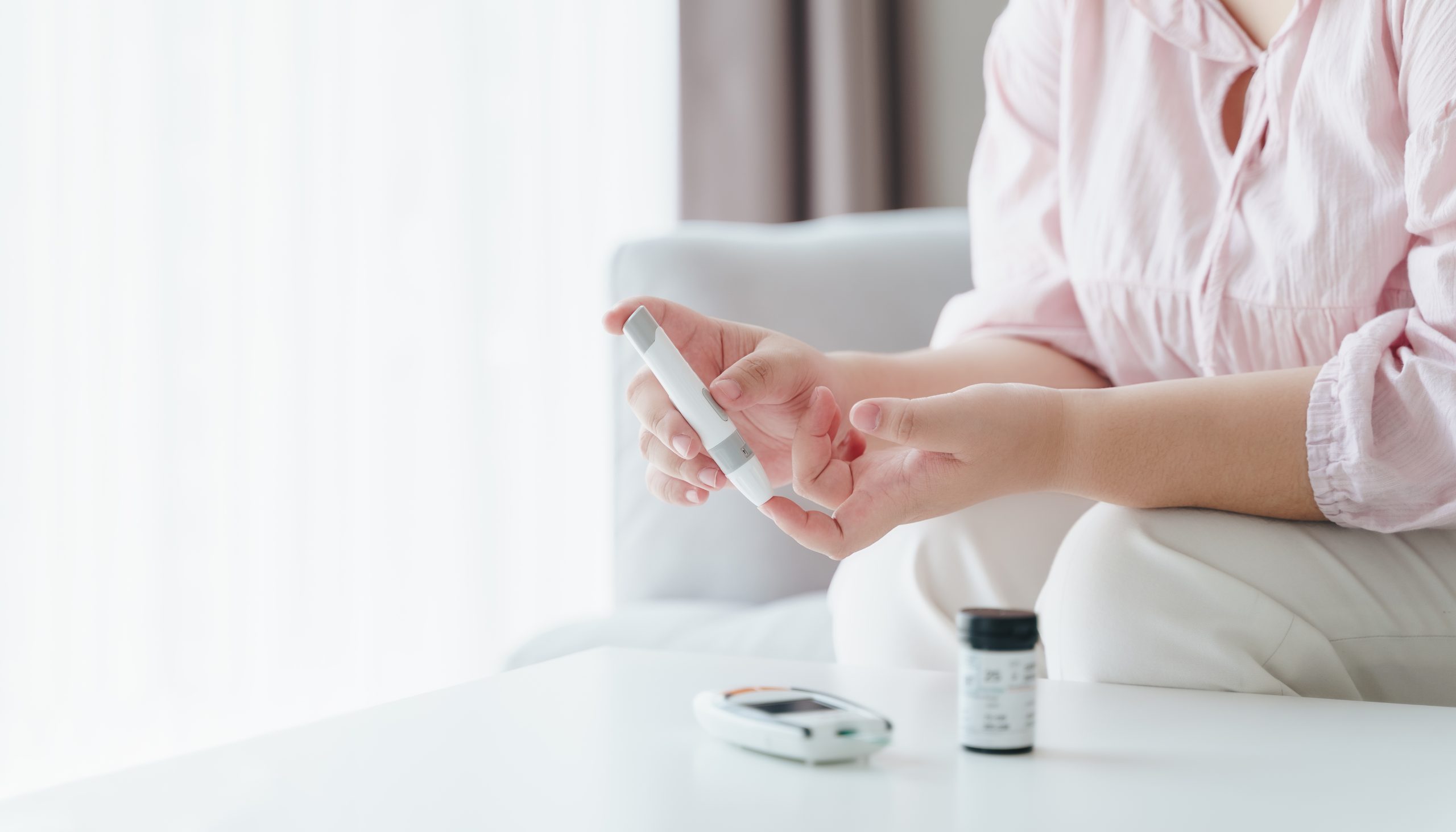 vecteezy asian woman using lancet on finger for checking blood sugar 10204572